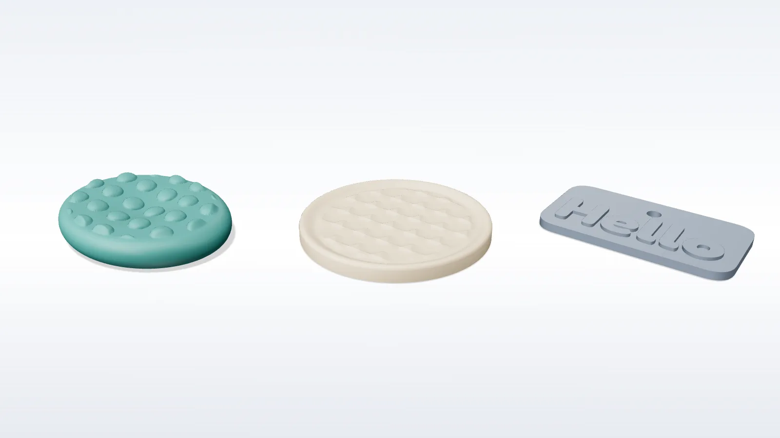 A worry stone, a patterned coaster and a keytag generated side by side
