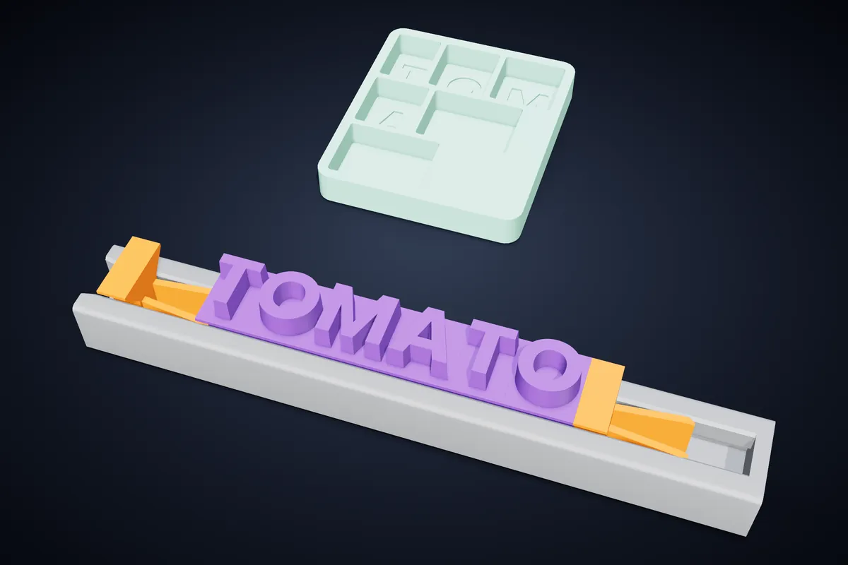 紫色字母印章排成 TOMATO，放在灰色滑軌中、夾在兩個橘色夾具之間，旁邊是格內刻有字母的薄荷綠收納盒